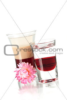 Two layered shot cocktails with flower