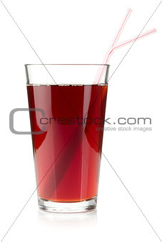 Pomegranate juice in a glass with two drinking straws