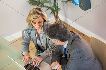 Business team going over work on the laptop