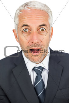 Shocked businessman looking at camera