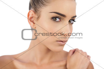 Close up of a thoughtful woman looking at camera