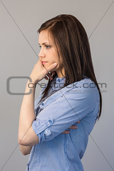 Thoughtful pretty brunette posing