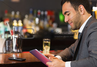 Close up of businessman sitting at bar