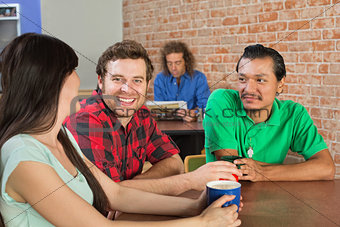Man Drinking Coffee with Friends