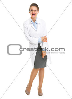 Full length portrait of smiling ophthalmologist doctor woman