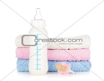 Baby bottle, pacifier and towels
