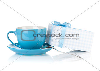 Blue coffee cup and gift box with bow