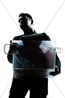 business man portrait carrying heavy box
