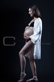 beautiful caucasian pregnant  woman in nightie