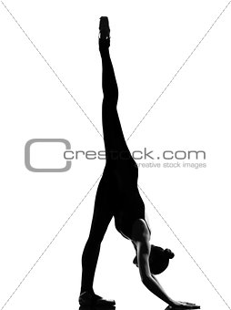 woman ballet dancer exercising splits stretching warming up