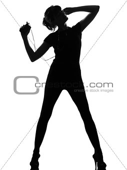 silhouette woman dancing and listening music