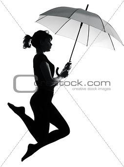 silhouette woman flying  holding open umbrella