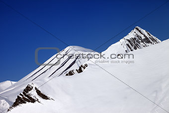 Off-piste slope and blue clear sky in nice day