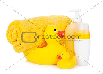 Rubber duck with bath towel and bottles