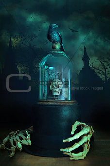 Glass bell jar with crow and skeleton hands