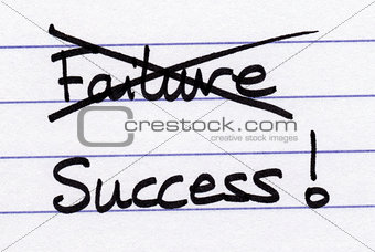 Crossing out Failure and writing Success.
