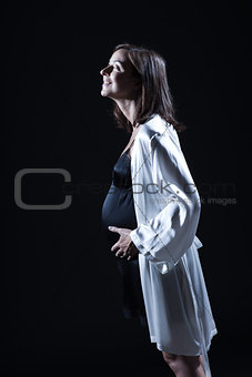 beautiful caucasian pregnant  woman in nightie
