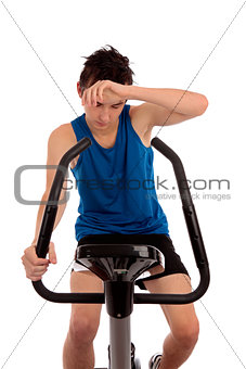 Exhausted after workout on exercise bike