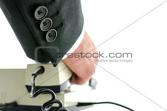 Rear view of businessman picking up the phone