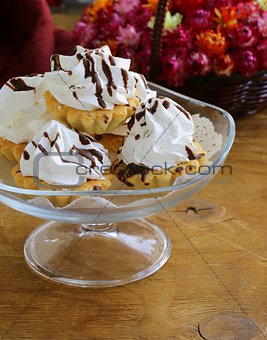 sweet dessert tartlets with meringue and chocolate