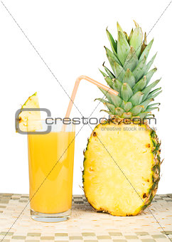 Pineapple and glass of juice