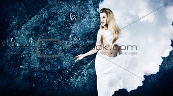 Blonde Woman in Cloud Dress at Grunge Blue Wall