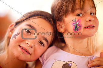 Cute Girls Showing Their Face Painting At A Party