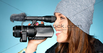 Hip Young Adult Female Points Video Camera Blue Background