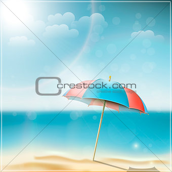 Summer day on ocean beach with umbrella