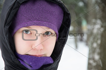 young teenage girl in black down jacket