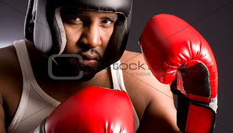 Tough African American Male Ready to Box Man Red Boxing Gloves