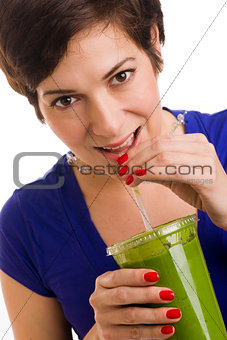 Pretty Brunette Woman sips Blended Green Wheat Grass Smoothie