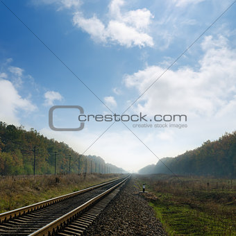 railroad in fog to horizon