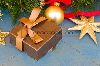 x-max present  box under fir tree