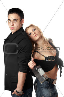 Serious young man and girl with a bottle