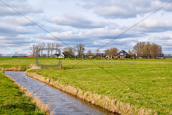 typical dutch farmland with canal