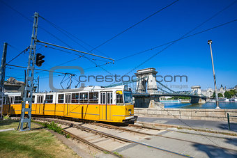 Yellow tram on the river bank of Danube in Budapest