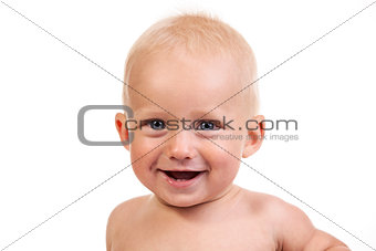 Portrait of a smiling nine-month old boy over white background
