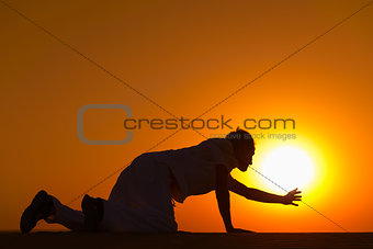 Tired and weaken man on all fours prays for help