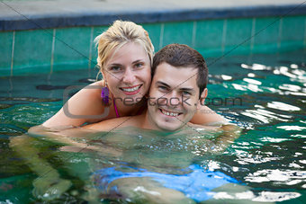 Happy honeymoon in a swimming pool