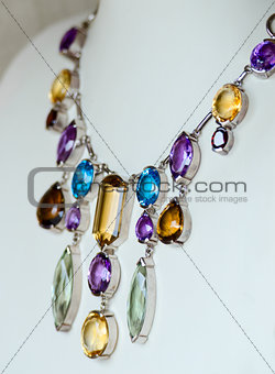 Necklace with colored precious jewel
