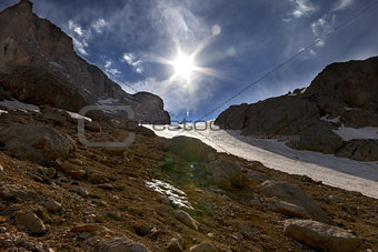 Mountain pass and blue sky with sun