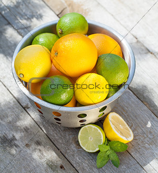 Fresh ripe citruses in colander