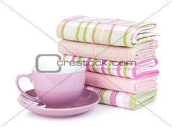 Kitchen towels and coffee cup