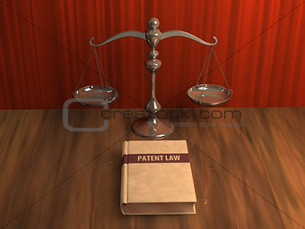 Scale and patent law book on the table