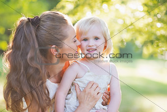 Portrait of happy mother and baby outdoors
