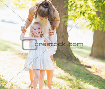 Portrait of smiling baby and mother