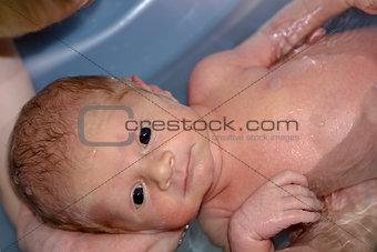 Cute baby boy enjoying bath