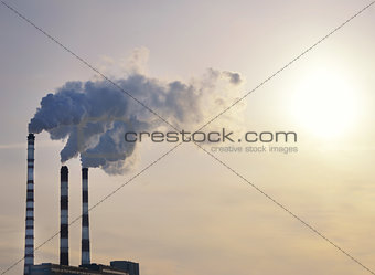 industrial smoke on sunset
