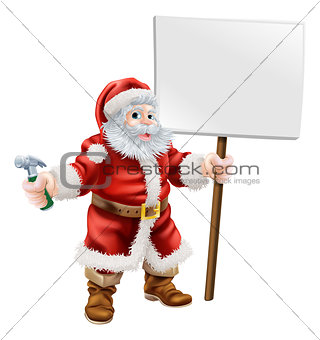 Santa holding hammer and sign